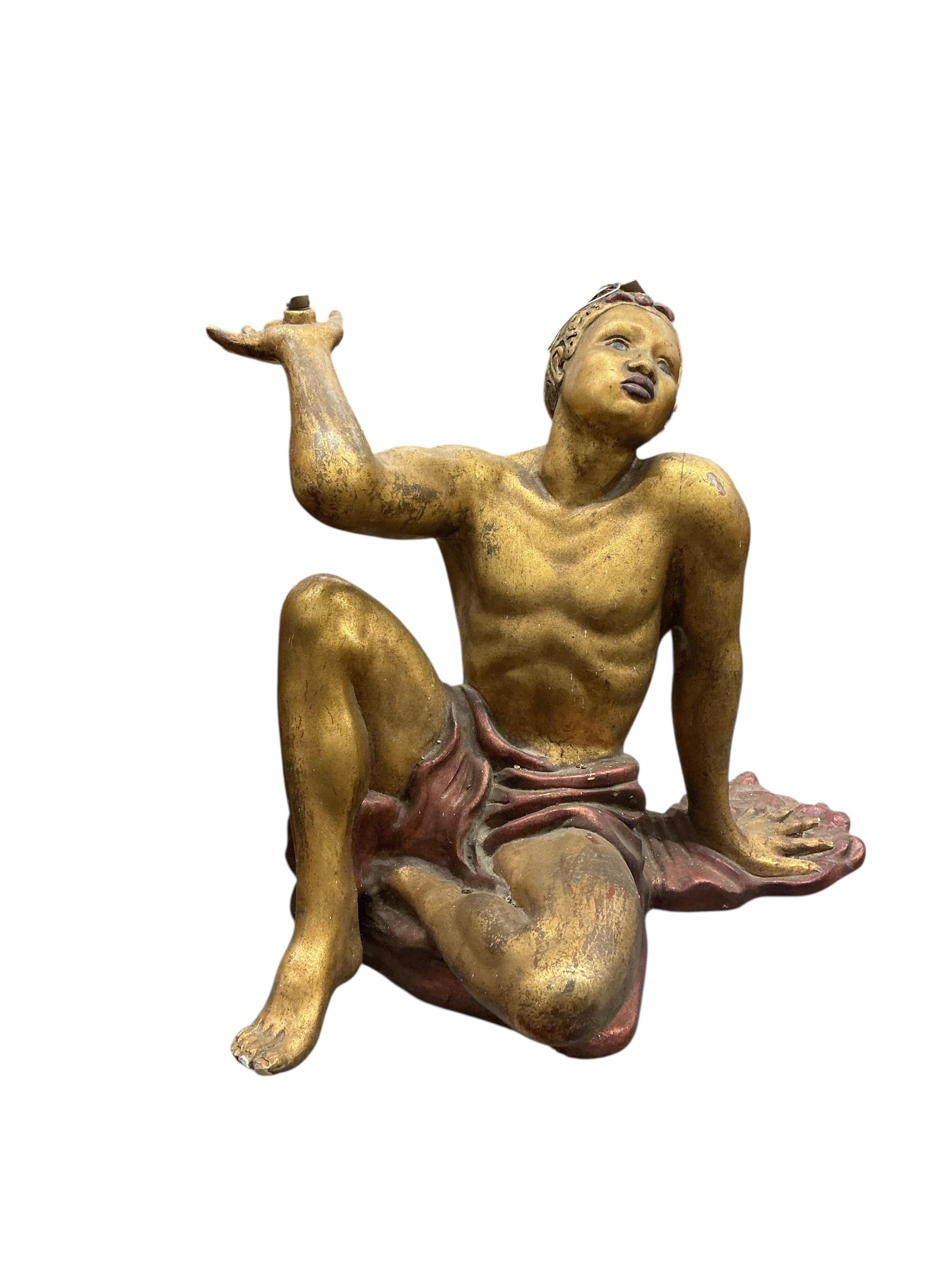 A pair of Venetian style painted carved wood seated Blackamoor figural table supports, height 54cm